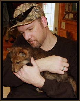 TJ with wolf pup.
